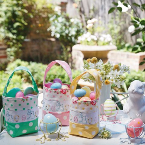 Styled shot of three different easter egg carry bags in the garden