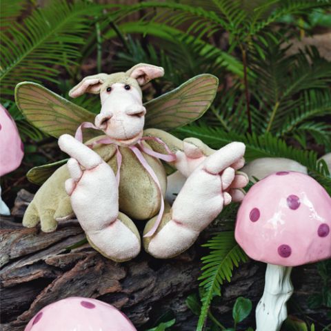 Styled shot of dimity the dragonfly in the forest with toadstools