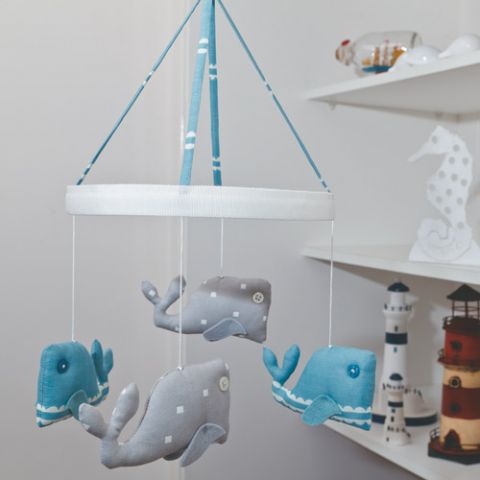Styled shot of whale baby mobile hanging up 
