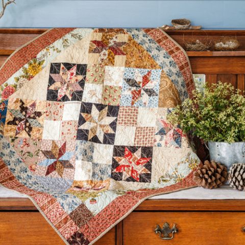 styled shot of winedale stars quilt